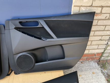 Обшивка двери Mazda 3 BL